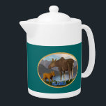 Moose in the Meadow Teapot<br><div class="desc">A mama moose and her cute calf with a lake and mountains in the distance. Text reading "Alaska" in a snow-covered font also appears. You may choose another background color.</div>