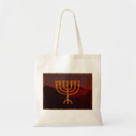Moshe's Menorah Tote Bag<br><div class="desc">In the Torah Moshe Rabbenu is told, "You shall make a Menorah of pure gold, beaten out, shall the Menorah be made, its base, its branch, its goblets, its knobs, and its flowers shall be hammered from it, " [Shmot 25:31] and later, "See, and construct, according to their form that...</div>