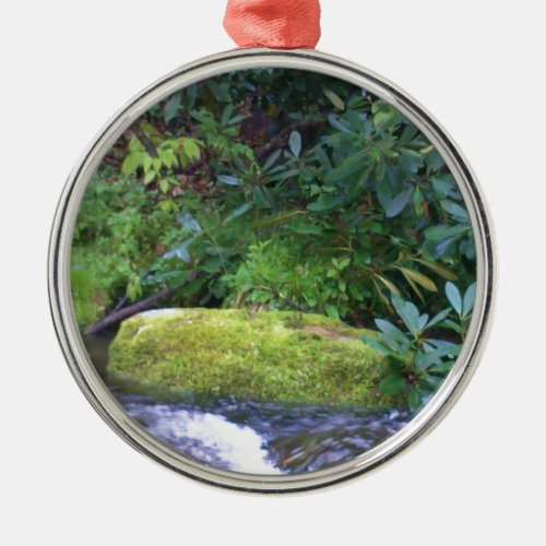 mossy rock on mountain stream metal ornament