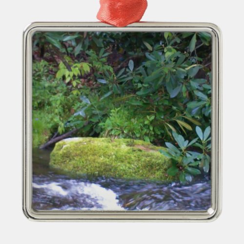 mossy rock on mountain stream metal ornament
