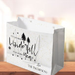 Most Wonderful Time of The Year Black Christmas Large Gift Bag<br><div class="desc">Most Wonderful Time of The Year Black Christmas Large Gift Bag . This elegant gift bag has a white background with the Christmas quote "ITS THE MOST WONDERFUL TIME OF THE YEAR " written in pretty typography style font along with the family name. Customize it by changing the name ....</div>