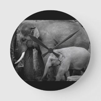 mother and baby elephant round clock