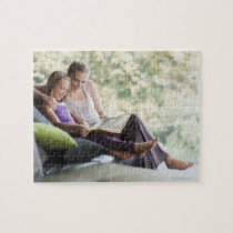 Mother and daughter reading storybook jigsaw puzzle