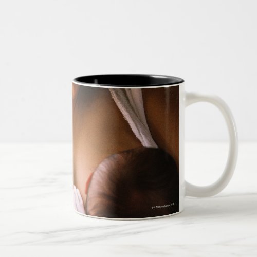 Mother breast feeding newborn Two_Tone coffee mug
