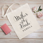 Mother of the Bride Black Personalized Wedding Tote Bag<br><div class="desc">Wedding Mother of the Bride tote bag features modern black swirling calligraphy script writing with elegant custom first name text that you can personalize. See our coordinating bridal party designs!</div>