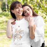 Mother of the bride copper glitter typography name T-Shirt<br><div class="desc">Glam elegant mother of the bride custom t-shirt with a copper brushed handwritten like typography script and a small heart.           Easy to personalize with her name.            Suitable for trendy modern glamorous wedding bridal parties.</div>