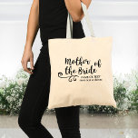 Mother of the Bride Tote Bag | Chic Modern Script<br><div class="desc">The Mother of the Bride will love this personalized tote bag! A fun trendy script font and swirl embellishment adorn the front of the bag and below there's space for two lines of custom text - add the Mother of the Bride's name, your wedding date, location, etc. Timeless and classic,...</div>