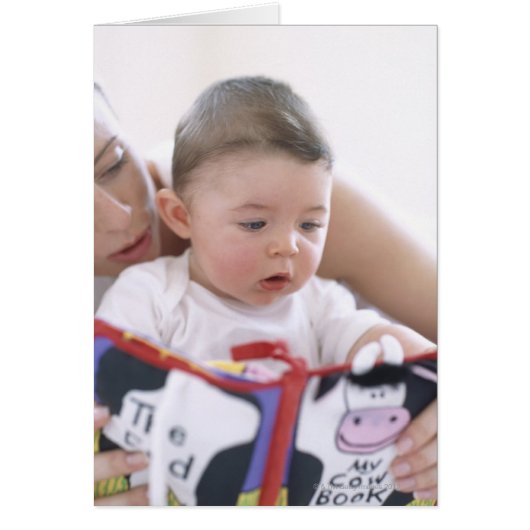 Mother reading to baby boy. Faces of a mother (Front)