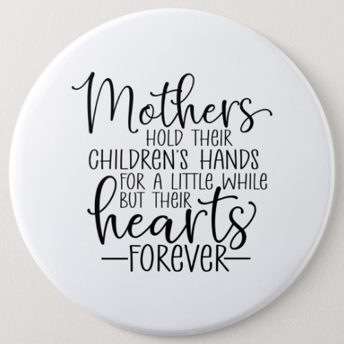 Mothers hold their childrens hand for a little  button