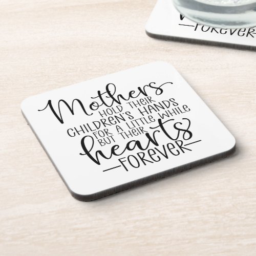 Mothers hold their childrenâs hand for a little wh beverage coaster