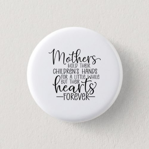 Mothers hold their childrenâs hand for a little wh button