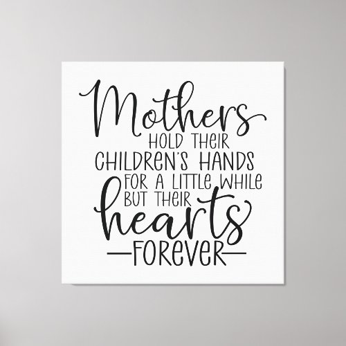 Mothers hold their childrenâs hand for a little wh canvas print