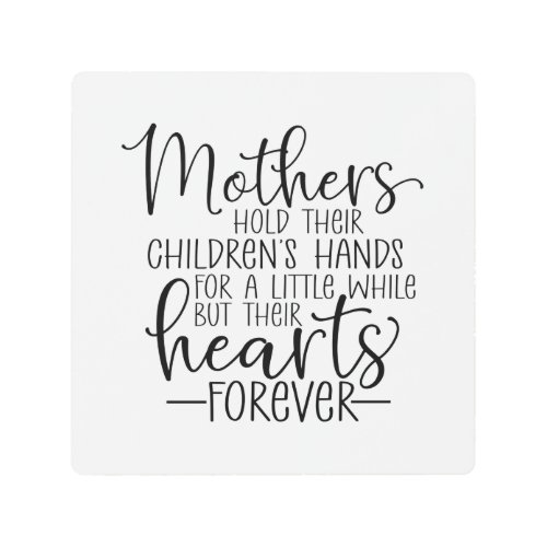 Mothers hold their childrenâs hand for a little wh metal print
