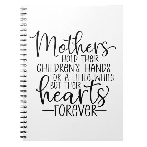 Mothers hold their childrens hand for a little wh notebook