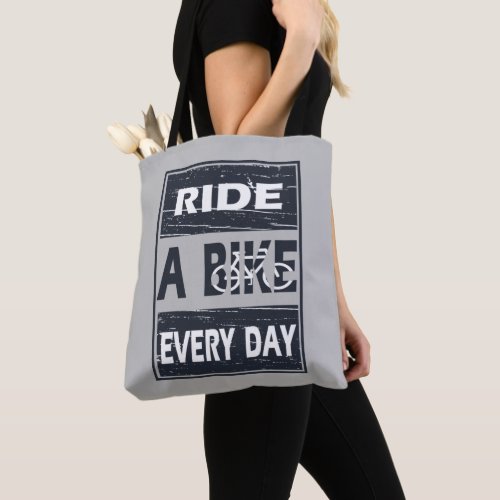 Motivational cycling quotes tote bag