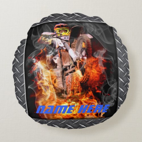 Motocross rider popping a wheelie through fire round pillow