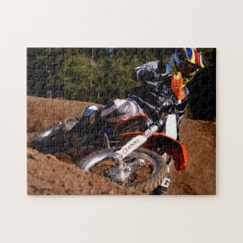 Motocross Rider Racing Hard Through The Corner Jigsaw Puzzle by McPhotoPosters at Zazzle
