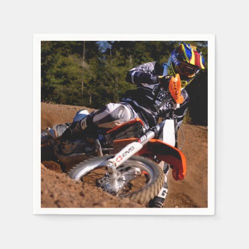 Motocross rider tearing up the track paper napkins