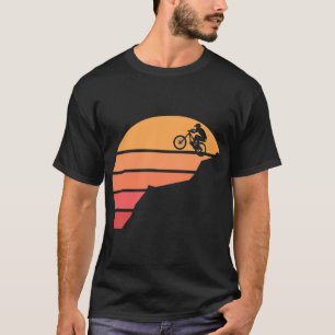 Mountain biking in the susnset T-Shirt
