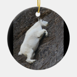 mountain goat climbing cliff ceramic ornament