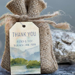 Mountain Lake Wedding Thank You Gift Tags<br><div class="desc">Mountain wedding favor gift tags with scenic watercolor design in shades of dusty blue and green. The lakeside scene features mountains, greenery and pine trees, the lake and a light sky. The template is set up to add the bride and groom names and wedding date. If you would like matching...</div>