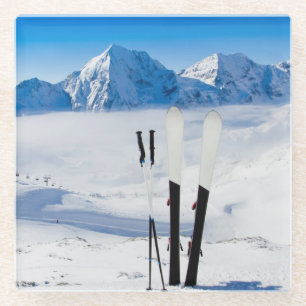 Mountains and ski equipment glass coaster