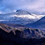 MOUNTAINS BELT BUCKLE<br><div class="desc">A photographic design of snow covered mountain tops in Wales.</div>