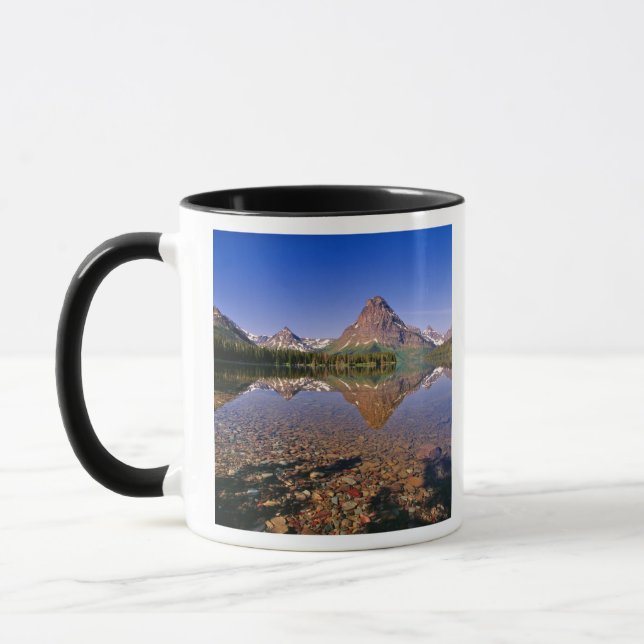 Mountains reflect into calm Two Medicine Lake in Mug (Left)