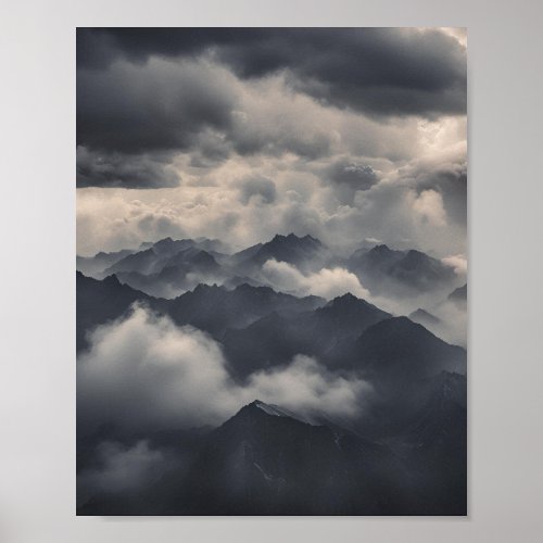 Mountains within the clouds in the sky poster