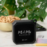 Mr And Mrs Newlyweds Monogram Name Bluetooth Speaker<br><div class="desc">Surprise a newly married couple with this Mr. And Mrs. Newlyweds Monogram Name Bluetooth Speaker. It is modern classy designed with a customizable black background and white trendy script lettering. The text is "Mr. & Mrs." in bold white hand lettered script followed by newlywed's last name. Established year is on...</div>
