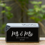 Mr And Mrs Newlyweds Monogram Name Bluetooth Speaker<br><div class="desc">Surprise a newly married couple with this Mr. And Mrs. Newlyweds Monogram Name Bluetooth Speaker. It has a modern classy design with a customizable black background and white trendy script lettering. The text is "Mr. & Mrs." in bold white hand lettered script followed by newlywed's last name. Established year is...</div>