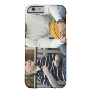 MR Man (age 25) and boy (age 6) sitting on park Barely There iPhone 6 Case
