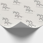 Mr & Mrs Classic Script Calligraphy Name Wedding Wrapping Paper<br><div class="desc">A modern classic and simple 'Mr. and Mrs.' black calligraphy script design with names that can be personalized, on an ivory cream background. The background color can be changed to any color of your choice. More font styles and editing features available within the product customisation page. This custom wrapping paper...</div>