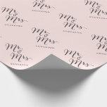 Mr & Mrs Classic Script Calligraphy Name Wedding Wrapping Paper<br><div class="desc">A modern classic and simple 'Mr. and Mrs.' black calligraphy script design with names that can be personalized, on a sweet pastel blush pink background. This custom wrapping paper is great for wedding favors, wedding parties, engagement and couples showers. The base background can be changed to any color of your...</div>