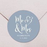 Mr Mrs Dusty Blue Wedding Classic Round Sticker<br><div class="desc">A chic dusty blue sticker for your wedding correspondence and party favors featuring "Mr & Mrs" in an elegant white script and a white illustration of two hearts joined together. Add your name and wedding date.</div>