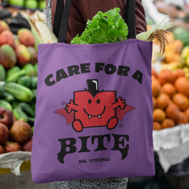Mr. Strong Care For A Bite Halloween Tote Bag (Person carrying tote bag in grocery store)