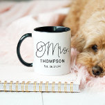 Mrs Calligraphy Script Black Est Date Mug<br><div class="desc">This chic Mrs mug features beautiful flowing calligraphy script with a custom last name in bold uppercase and an established wedding date, all on a crisp white background with a sleek black handle and interior. The elegant script paired with the bold black contrast creates a modern yet romantic look. The...</div>