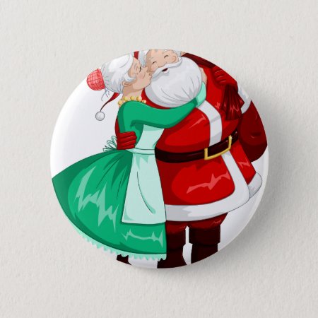 Mrs Claus Kisses Santa On Cheek And Hugs Button