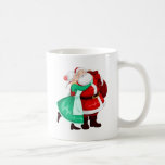 Mrs Claus Kisses Santa On Cheek And Hugs Coffee Mug at Zazzle
