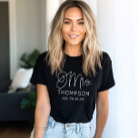 Mrs Script Calligraphy Monogram Newlywed Tri-Blend Shirt<br><div class="desc">Make a statement in this sleek black tee featuring an oversized "Mrs." in graceful script calligraphy with a customizable last name and established date. The white-on-black contrast gives it a modern,  elevated feel perfect for bachelorette weekends,  honeymoon packing,  or newlywed life. Personalize every detail to celebrate your milestone.</div>