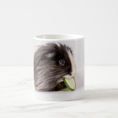 Mug with cute guinea pig eating cucumber