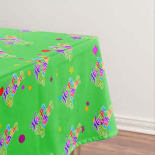 Multi Color Happy Birthday Graphic on Green Tablecloth
