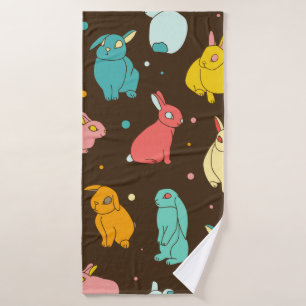 Multi-colored, different rabbits, hares on a dark bath towel