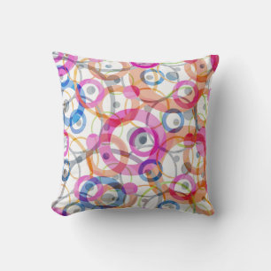 Multi-colored polka dots, circles on a white throw pillow