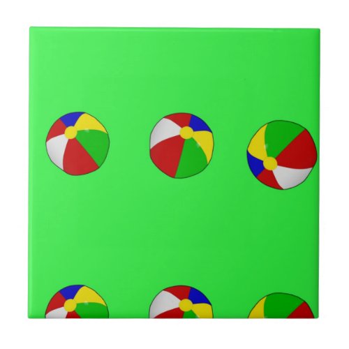 Multicolor beach ball on green ceramic tile