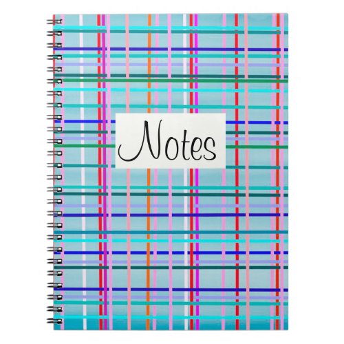 Multicolor check stripes pattern on blue notebook