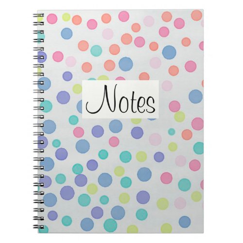 Multicolor dots on grey notebook