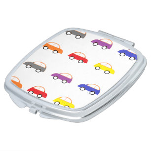 Multicolor mini cars on white compact mirror