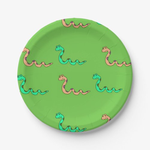 Multicolor snakes on green paper plates