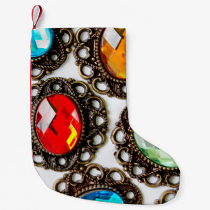 Multicolor vintage brooches on white backgroundbro small christmas stocking